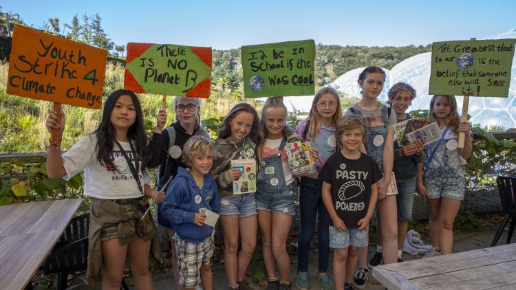 Children holding placards at the Eden Project