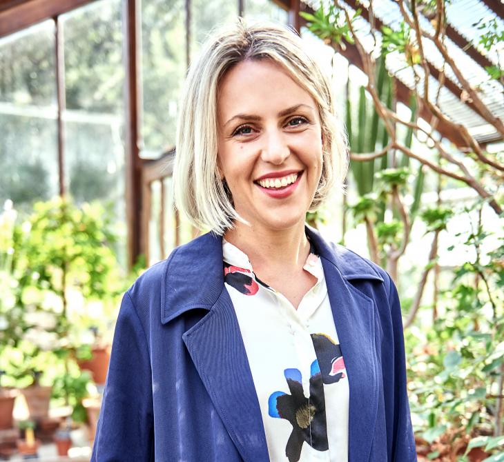 Artist Alexandra Daisy Ginsberg in a greenhouse