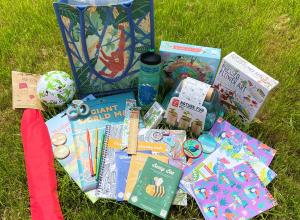 Selection of creative prizes including a jute shopping bag, red kite and notebooks