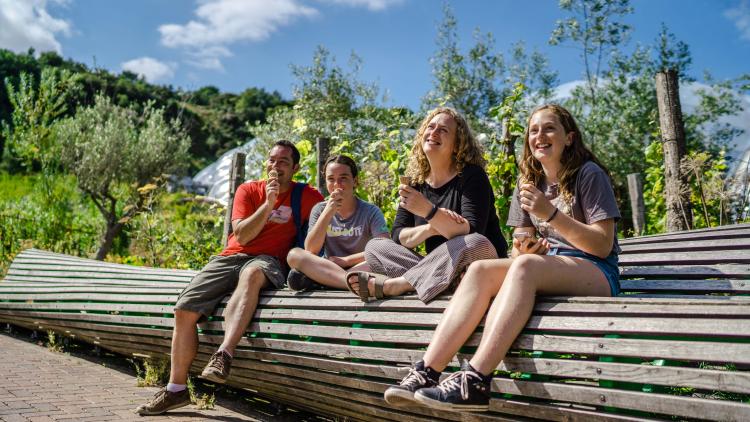 Family eating ice creams on bench at Eden Project