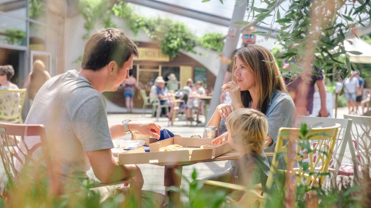 Family enjoying pizza in an Eden Project café