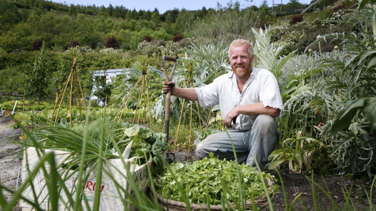 Gardener in Global Gardens allotment at Eden Project