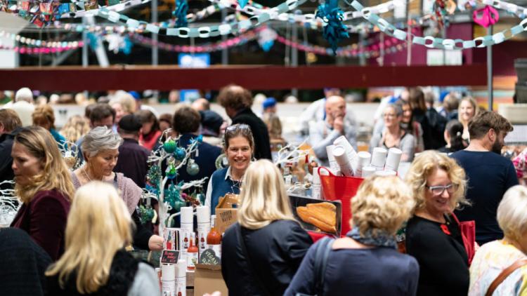 People shopping at a sparkly Christmas fair