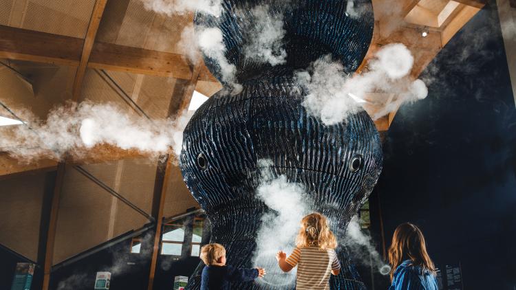 Family looking at Infinity Blue sculpture