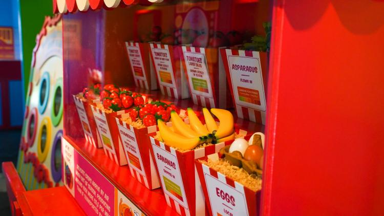 A fruit stall depicting air miles of different fruit