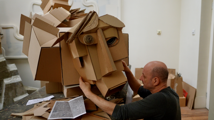 Simon Bingle creating his sculpture made from carboard