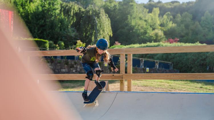 Girl on skateboard on a ramp