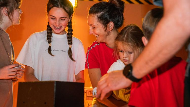 Family playing an escape room