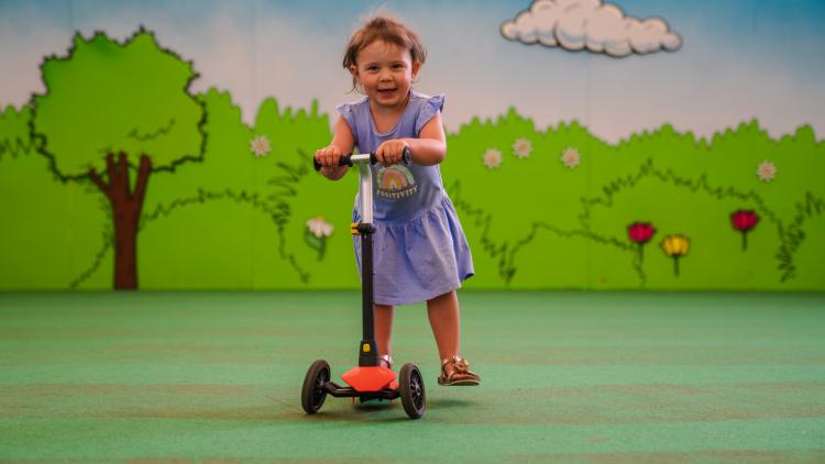 Toddler on scooter