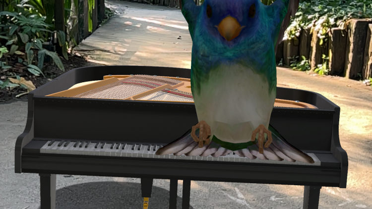 An AR bird sits atop a piano in the Rainforest Biome