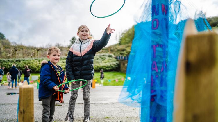 Boy and girl playing hoopla