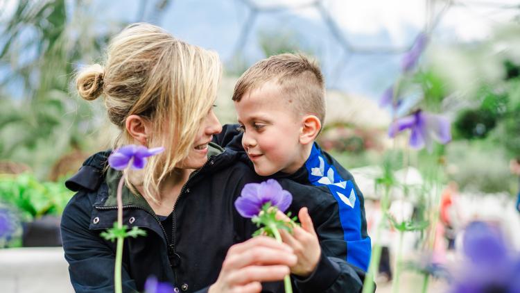 Mother and son looking at spring flowers at the Eden Project