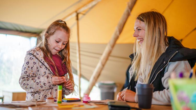 Mother and daughter doing a craft activity together