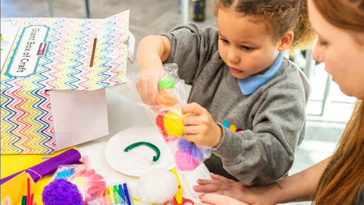  Crafts Council: Child enjoying crafting activity with educator