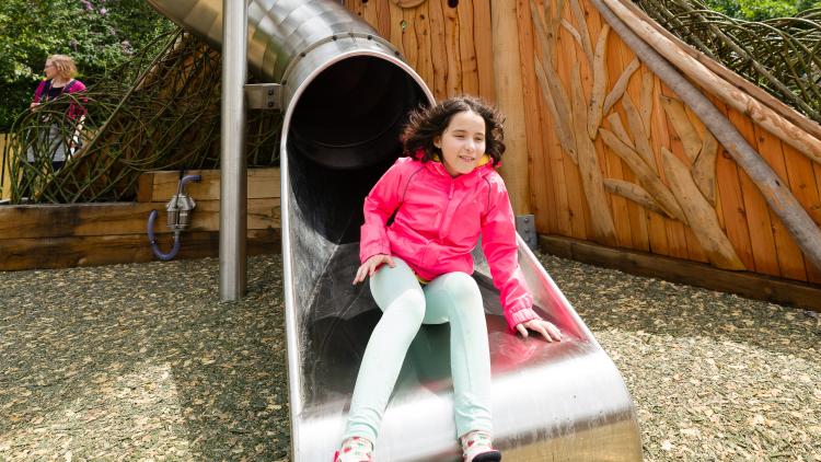 Girl coming out of slide