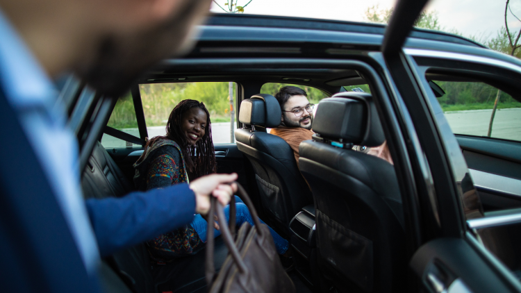 A group of people car sharing