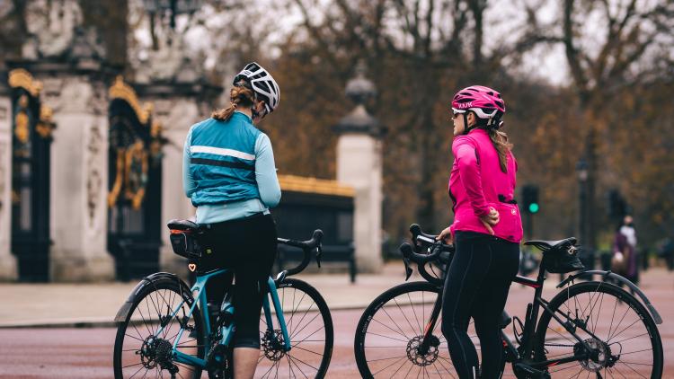 Two cyclists taking a break