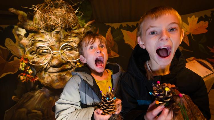 Children screaming with Tree Giant in the background