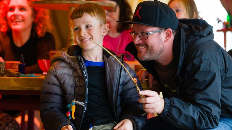 Father and son with wand