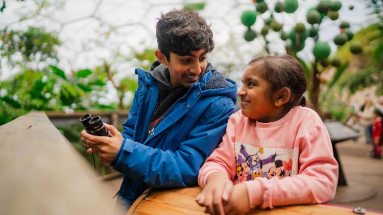 Children holding binoculars in the Eden Project Rainforest Biome