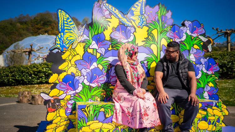 Couple sat on wildflower seat at the Eden Project