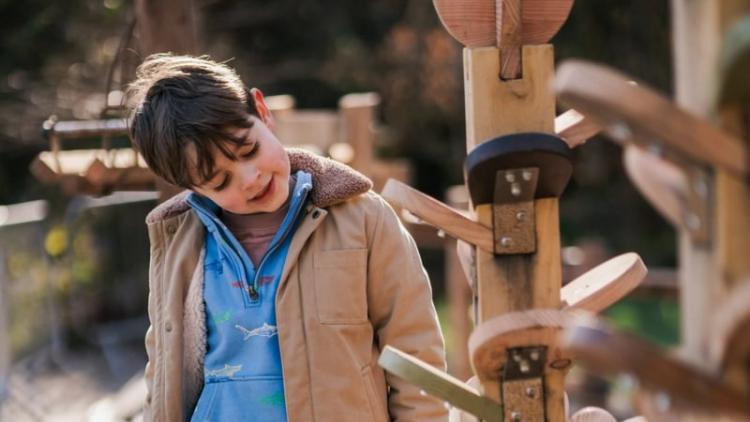 Child looking at giant marble run