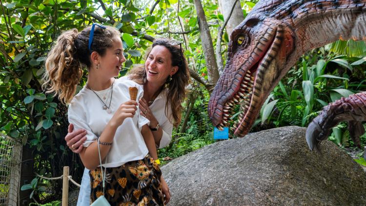 Mum and daughter meeting a dinosaur