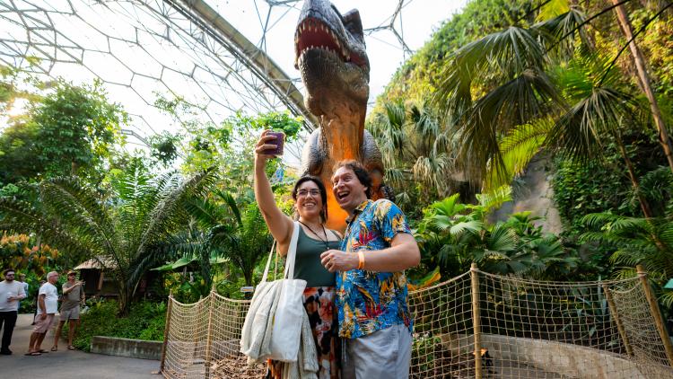 Couple taking a selfie with a T-Rex