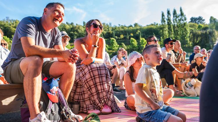 Families watching stage show