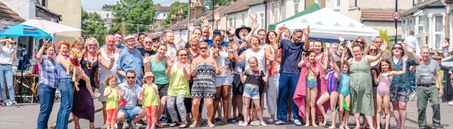 Group of neighbours in a street at a party