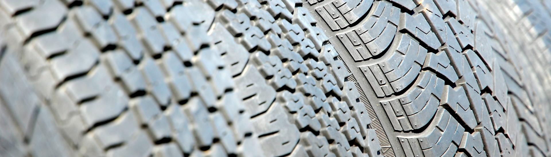 A close up of the tread on a car tyre 
