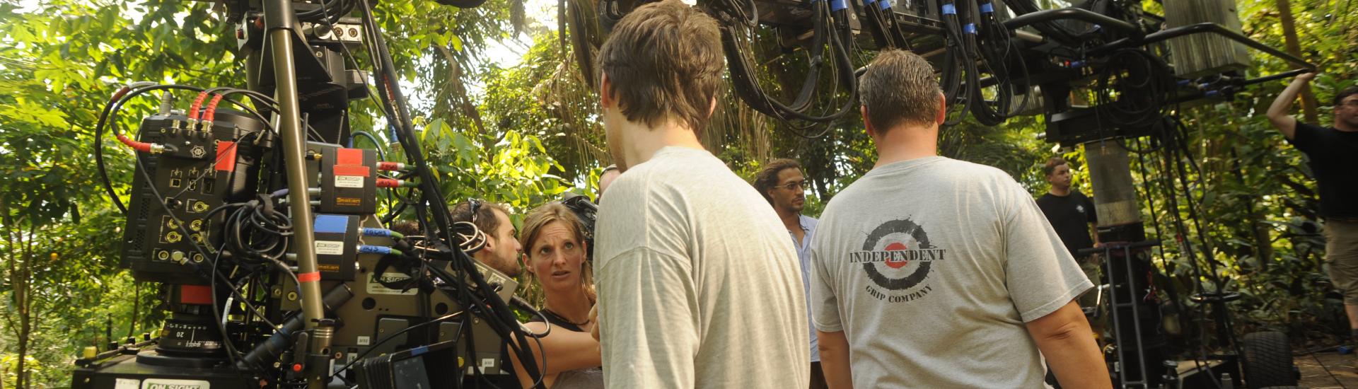 A camera crew standing around a camera set up in the Eden Project