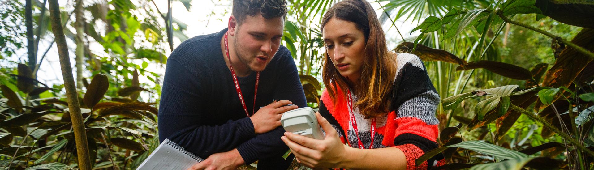 Horticulture students in the Rainforest Biome conducting a science experiment