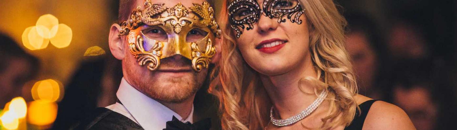 Masked couple at Christmas party