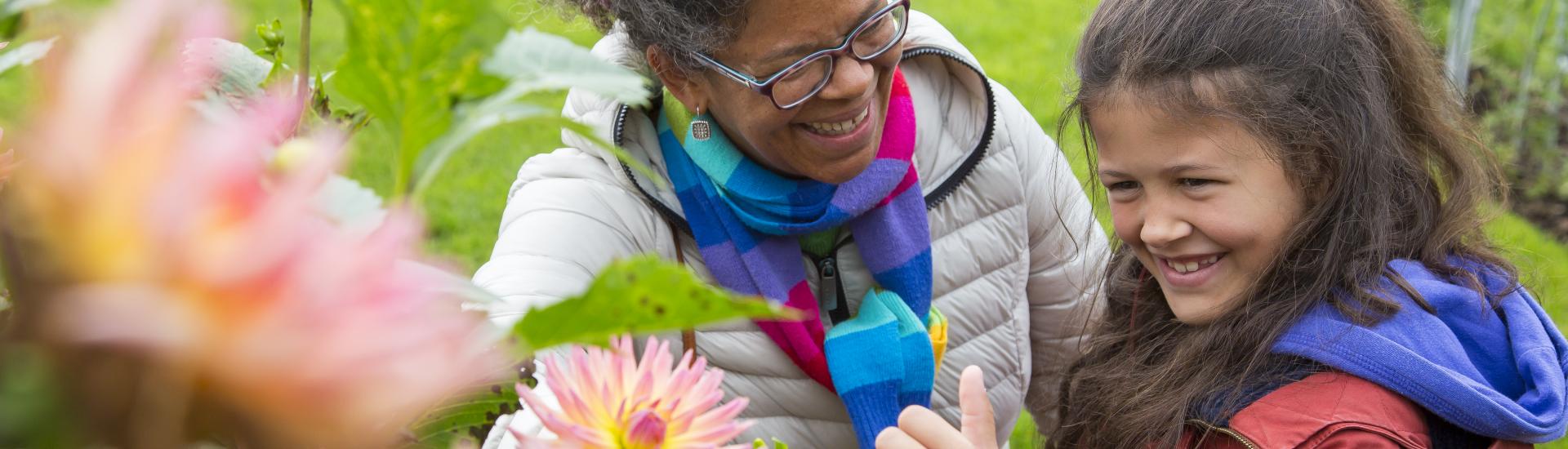 Mother and daughter looking at plants