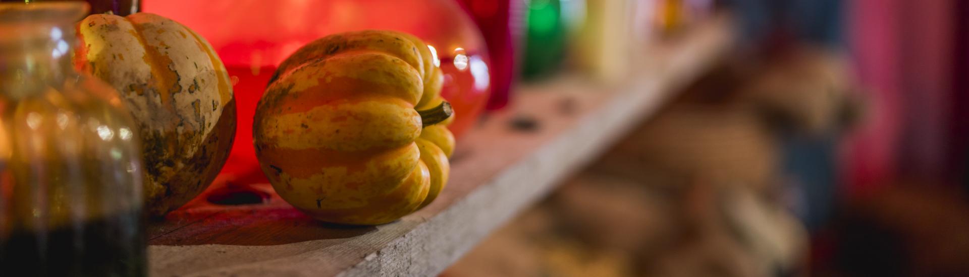 Up close shot of a pumpkin on a shelf