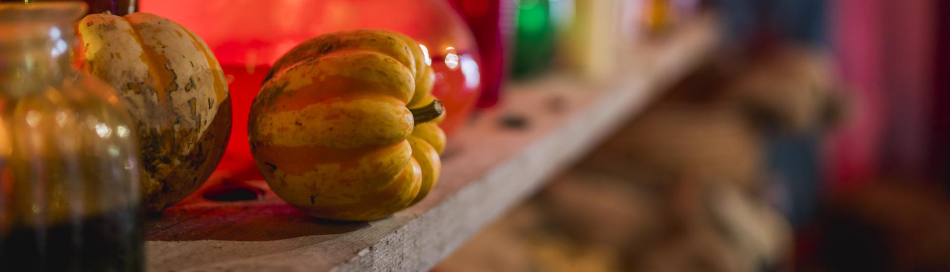 Up close shot of a pumpkin on a shelf