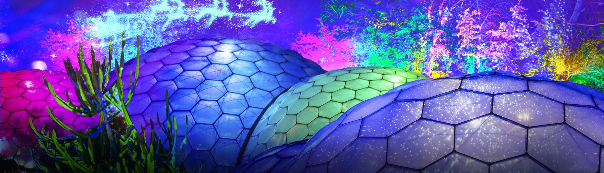 Eden's Biomes light up with Christmas lights and Father Christmas in his sledge flying through the sky