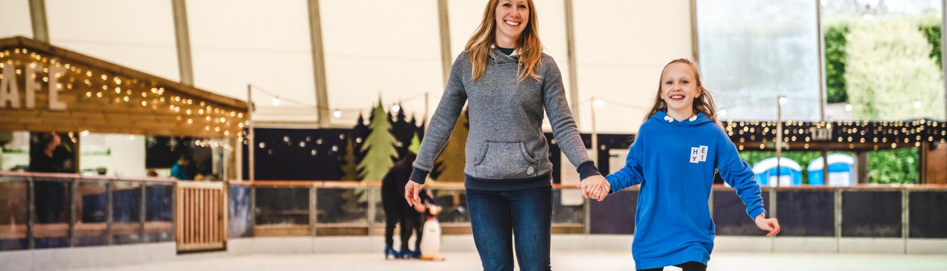 Mum and daughter ice skating